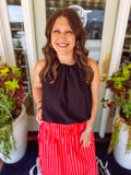 Black bubble hem top with a tie halter neck detail.