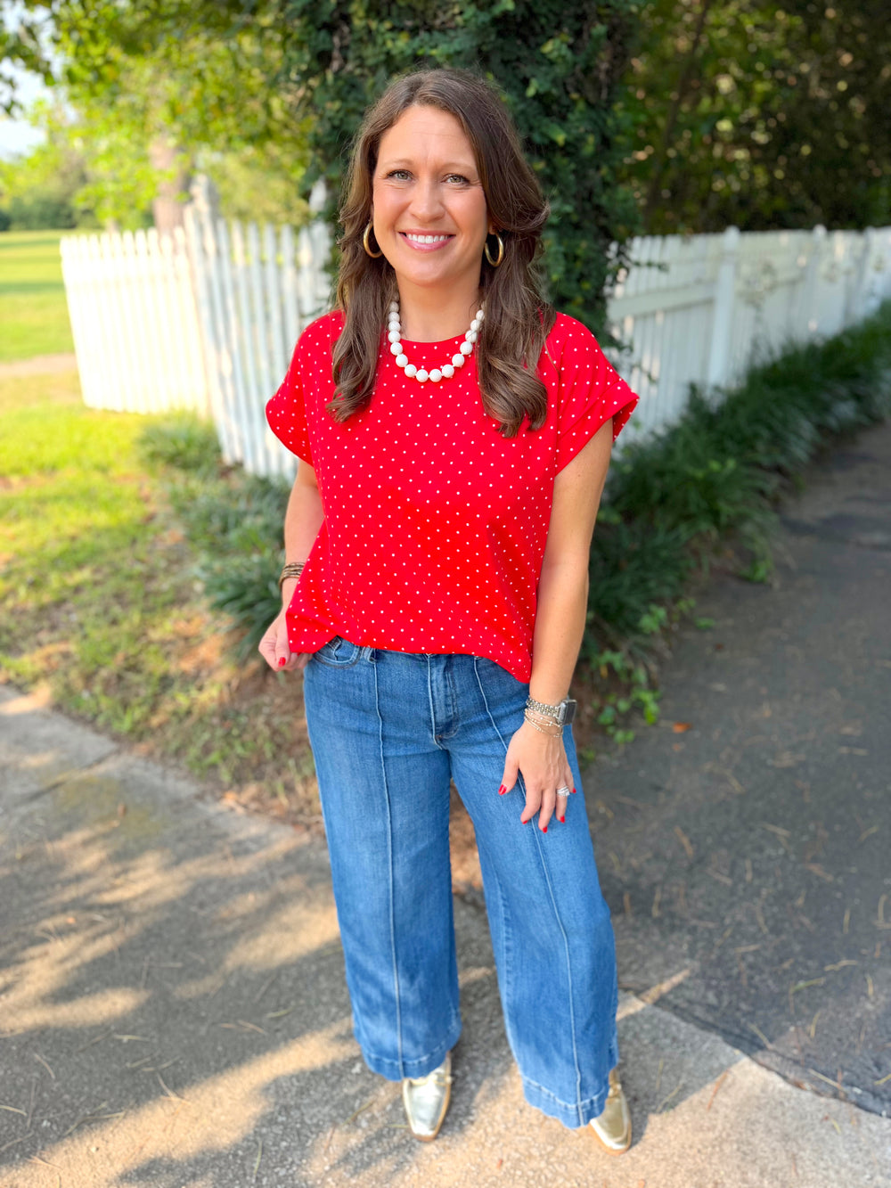 A red short-sleeve top with white polka dots.