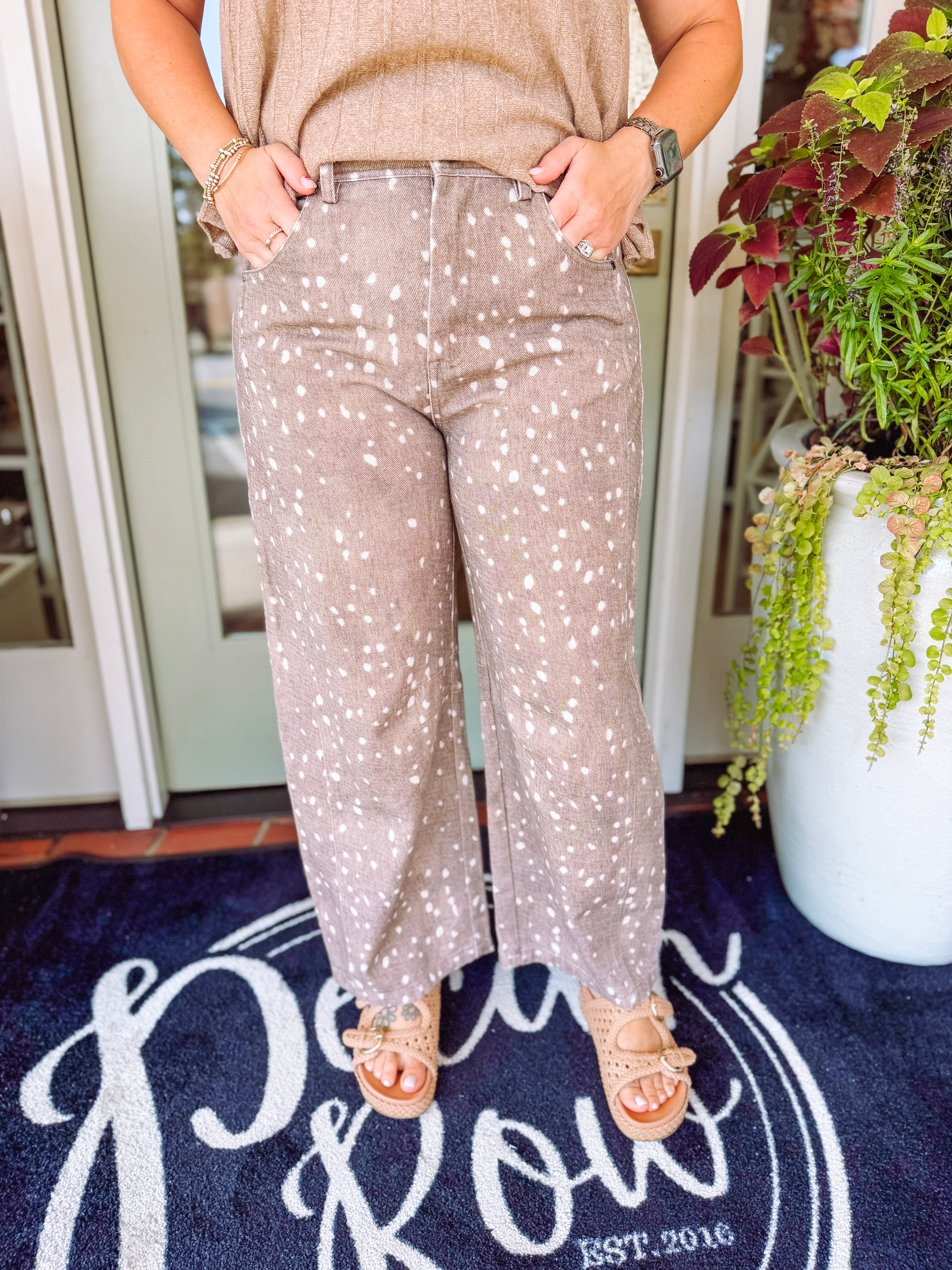 Taupe spotted wide-leg jeans feature an allover ivory animal-inspired print 