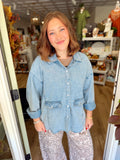  This top features a relaxed, oversized silhouette with a classic collar, snap-button front, and oversized flap pockets. 