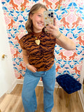 This camel and chocolate tiger print sweater top features a fitted silhouette with cap sleeves and a ribbed mock neckline.