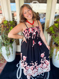 This sleeveless dress features a pretty allover floral print with a clean straight neckline and a flowy maxi-length silhouette.