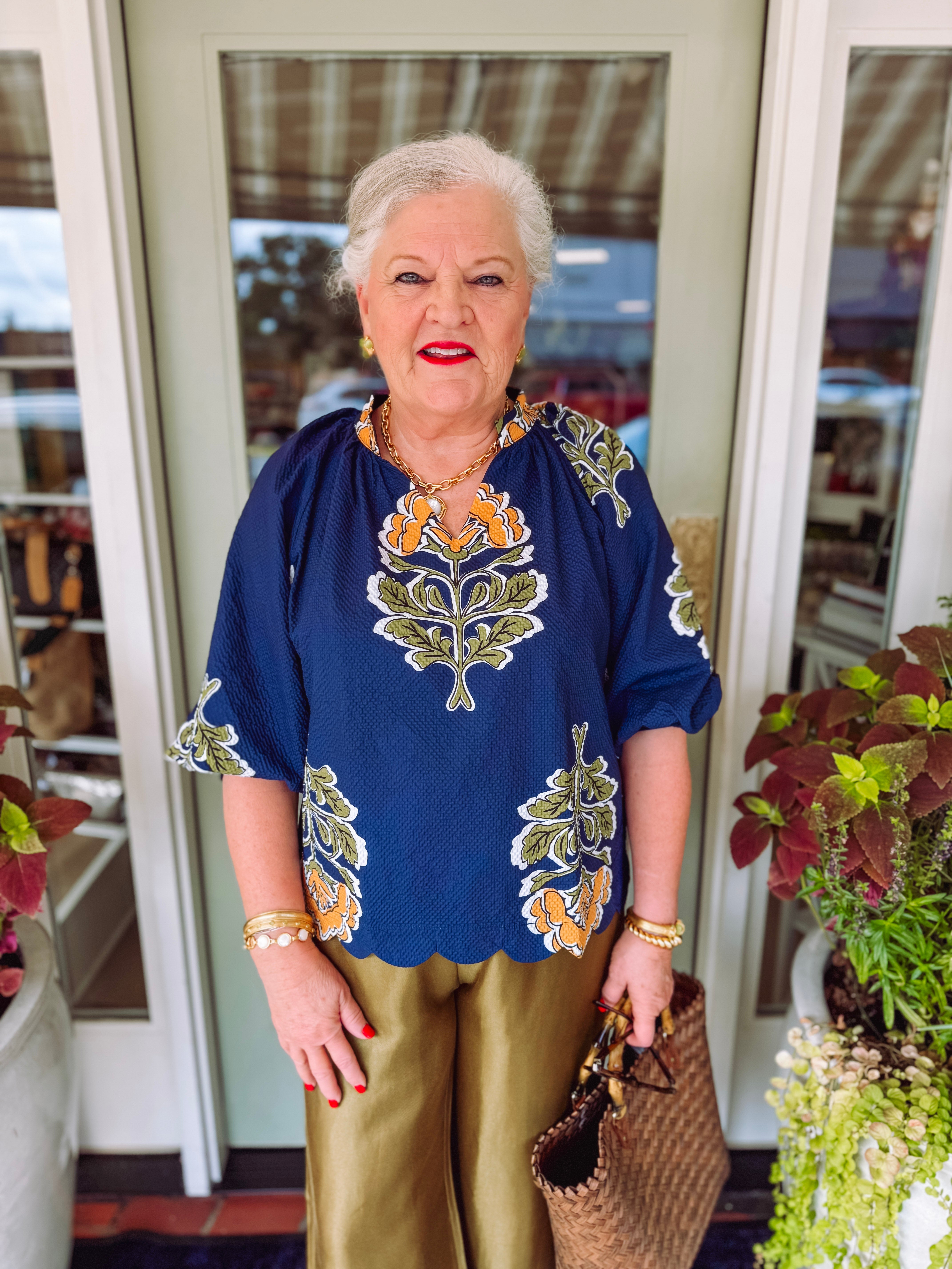 Navy floral printed blouse with v-neckline and 3/4 length sleeves