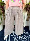 These mocha and cream gingham pants feature a relaxed wide-leg silhouette with pretty pleated detailing for a little extra shape and movement. 
