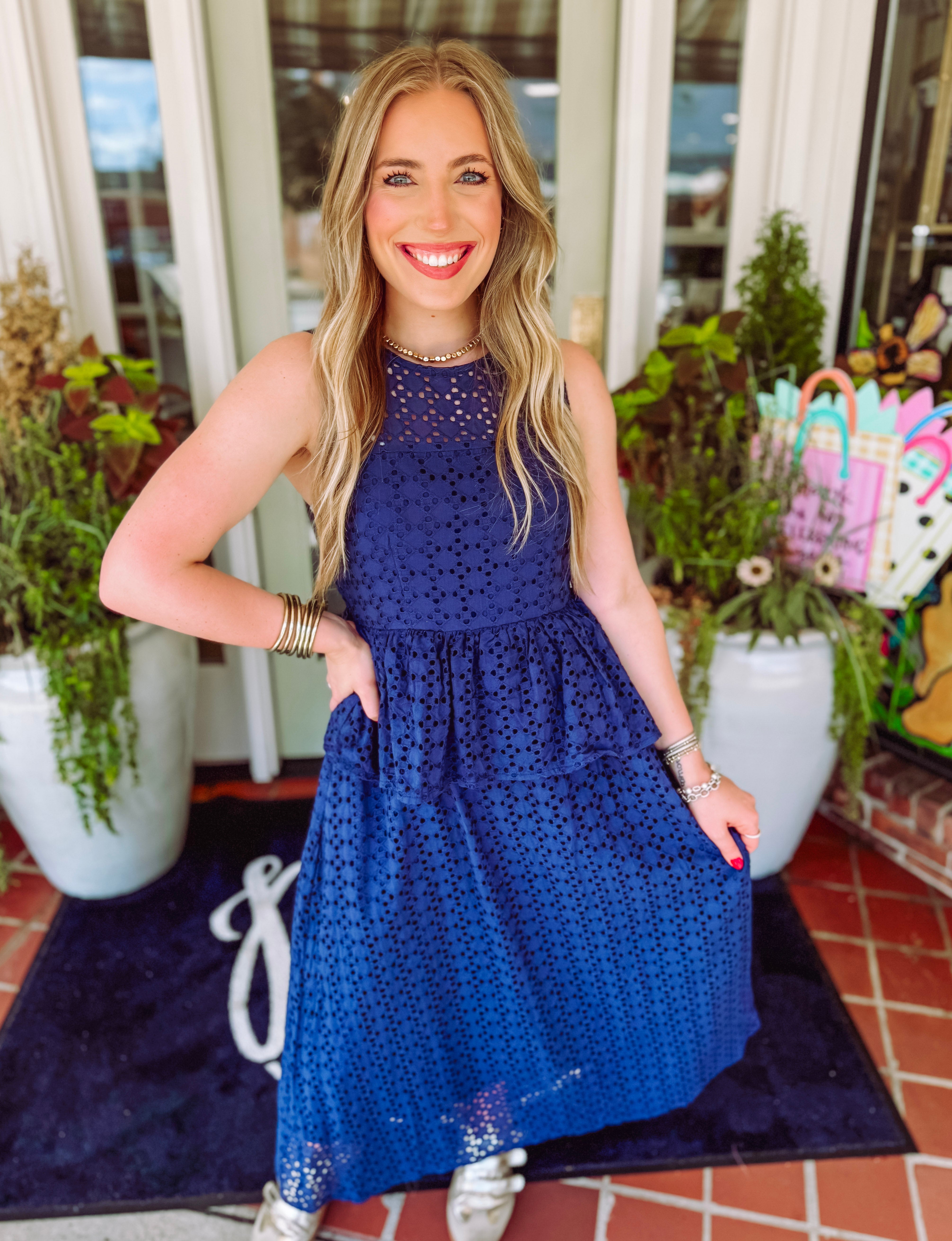 Navy eyelet midi dress with a tiered detailing 