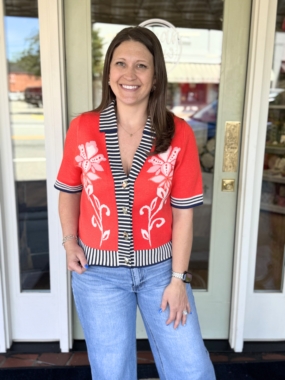 red sweater with white flowers