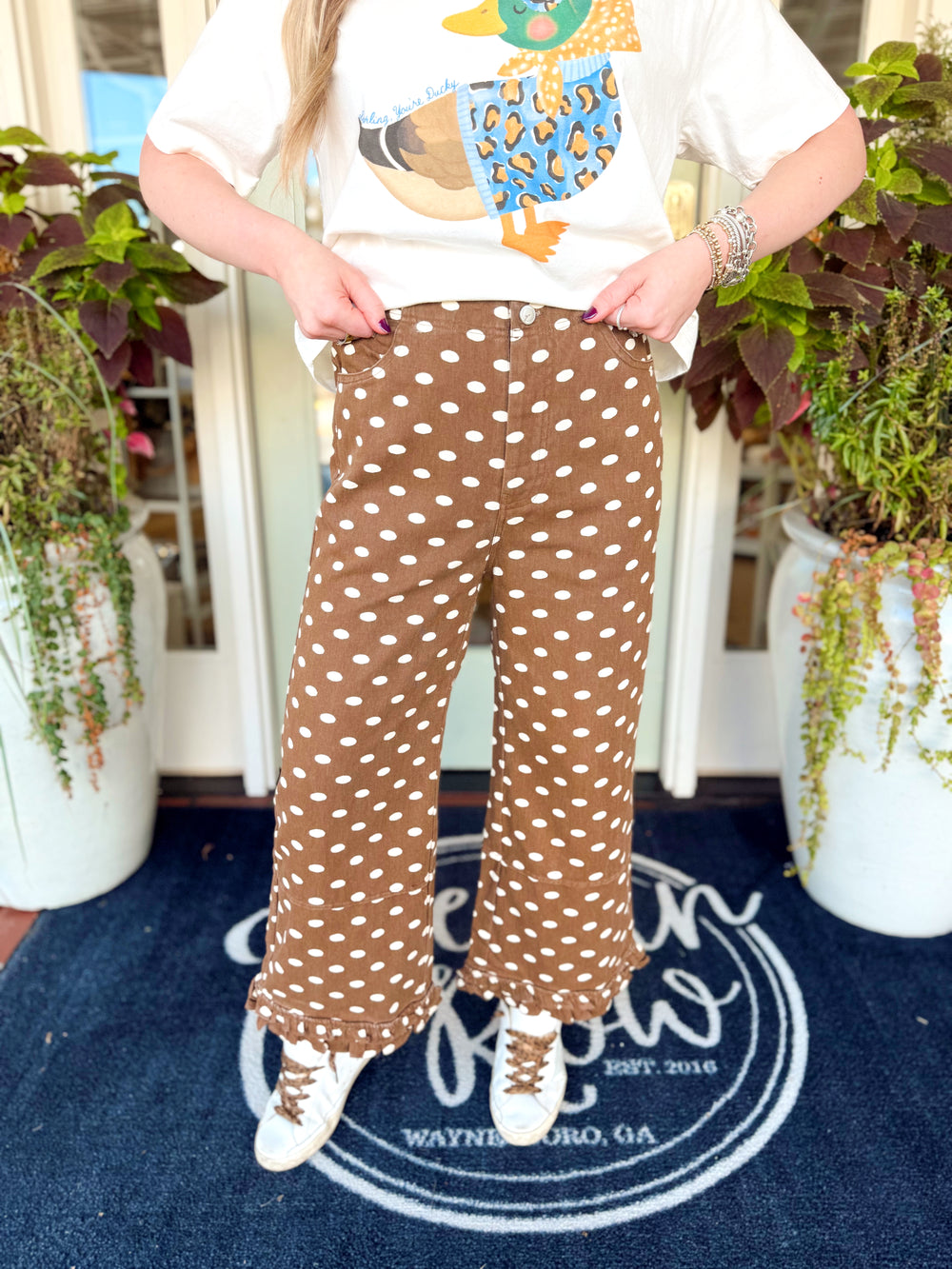 Brown and cream polka dot pants with ruffle detailing on the bottom