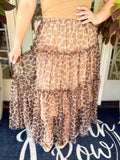 This statement midi skirt features an allover leopard print with layers of airy tulle and a tiered silhouette that gives it the prettiest movement.