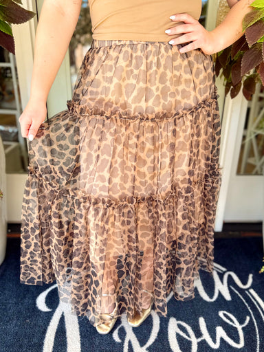 This statement midi skirt features an allover leopard print with layers of airy tulle and a tiered silhouette that gives it the prettiest movement.