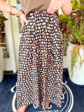 This dot print skirt features a comfortable pull-on design with a flowy silhouette that makes getting dressed effortless.
