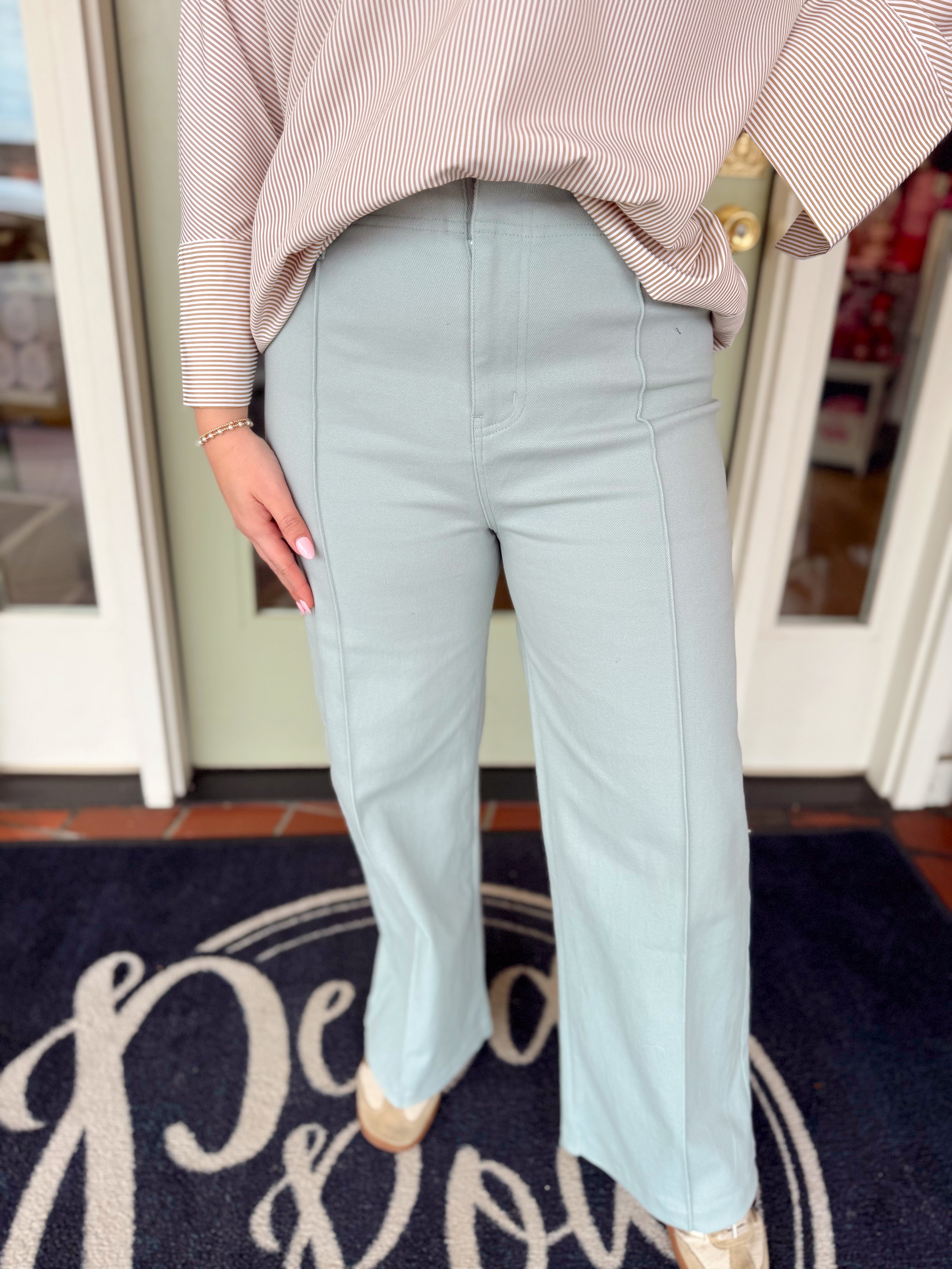 Seafoam wide leg pants with a decorative seam going down the front
