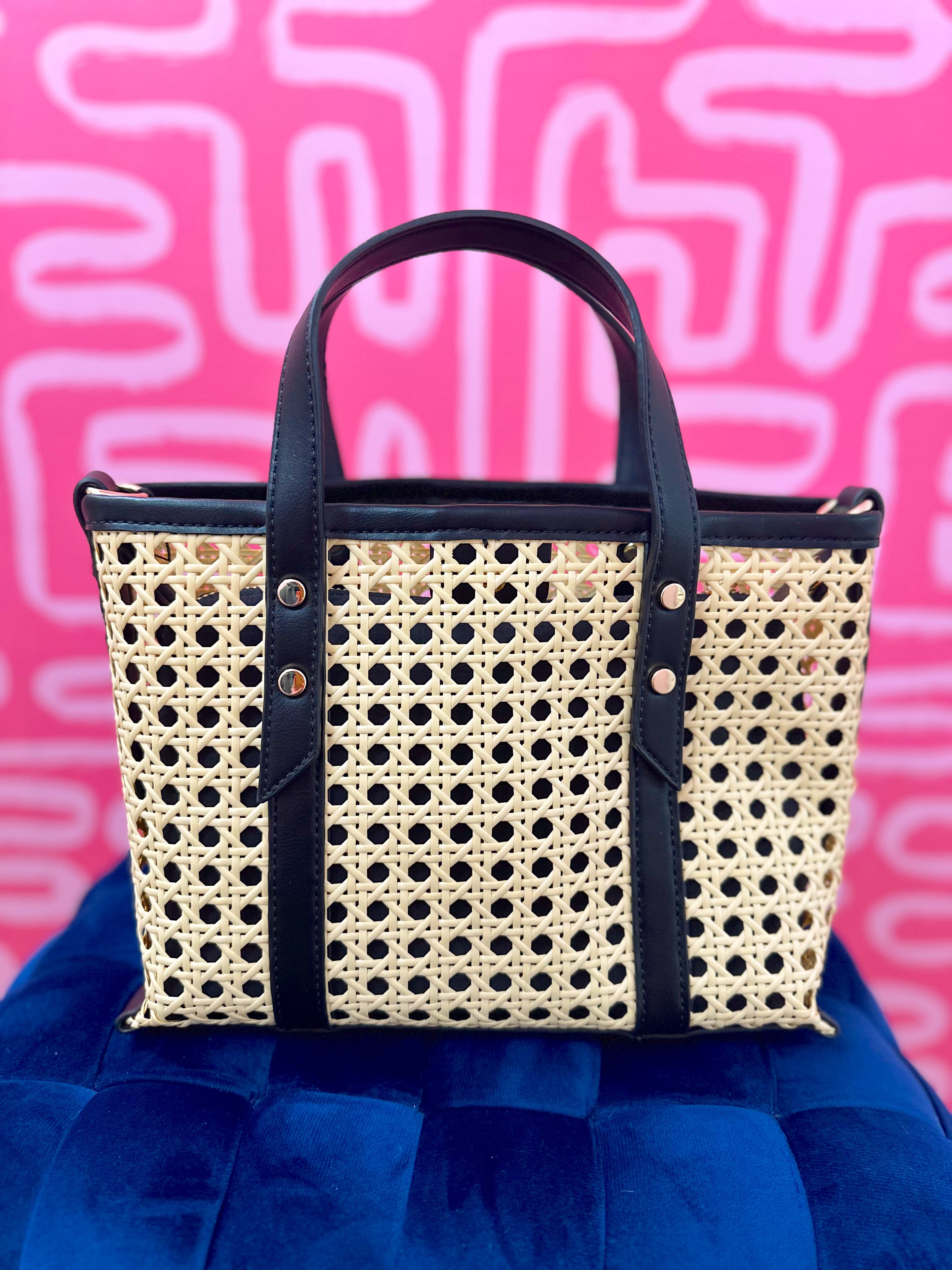 Woven handbag with black handles