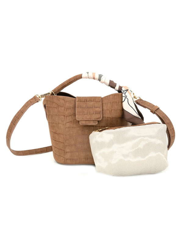 This rich brown handbag features a croc-embossed finish, structured bucket shape, and a removable crossbody strap for easy everyday wear.