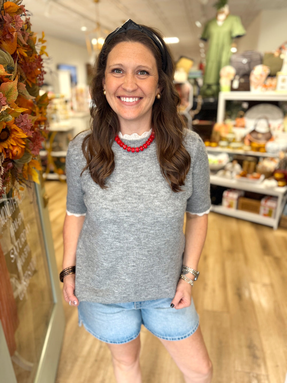 Grey short sleeve sweater top with ruffle neck and sleeves 