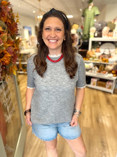 Grey short sleeve sweater top with ruffle neck and sleeves 