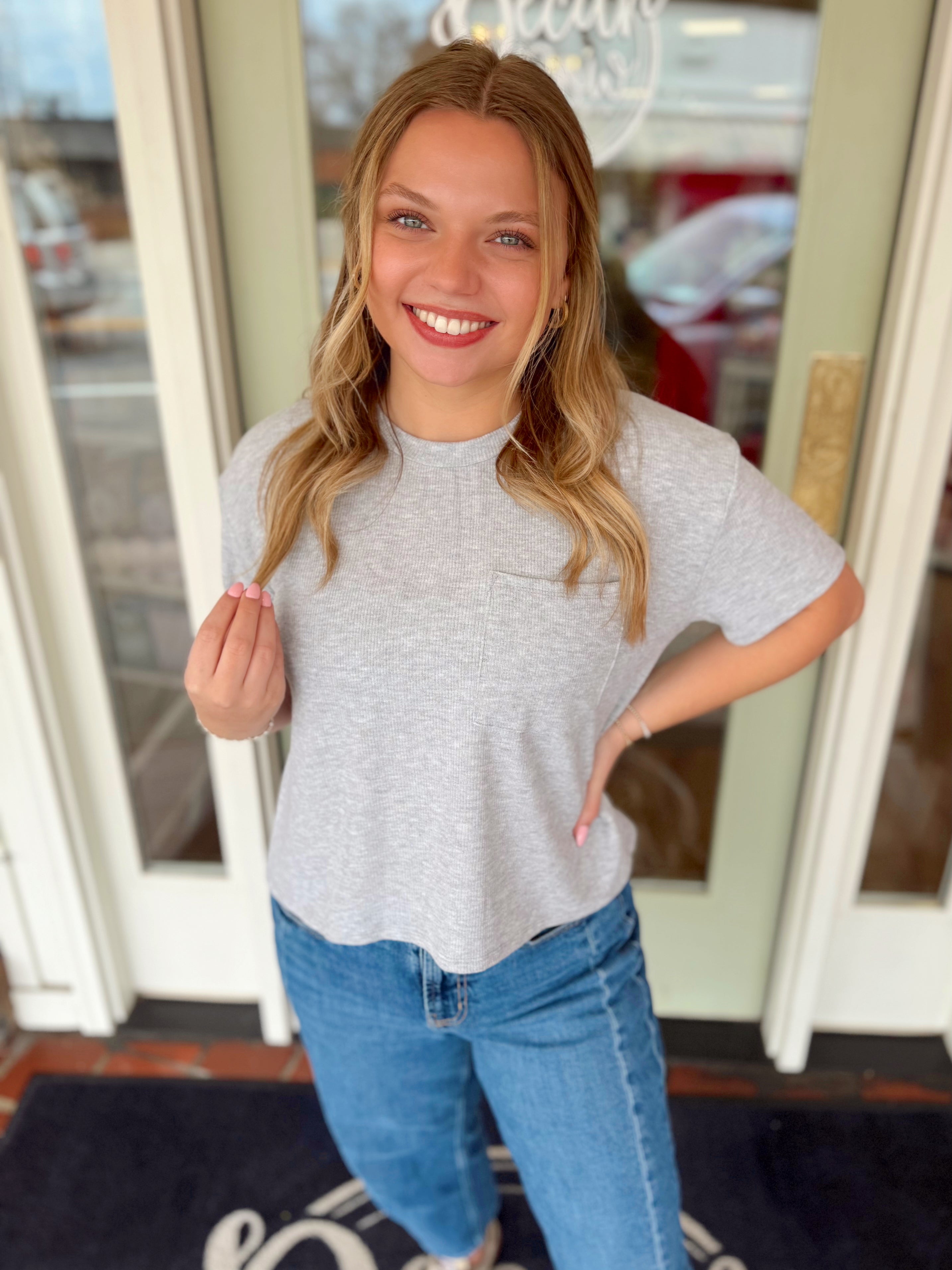 Soft grey short sleeve top with a pocket on the front 