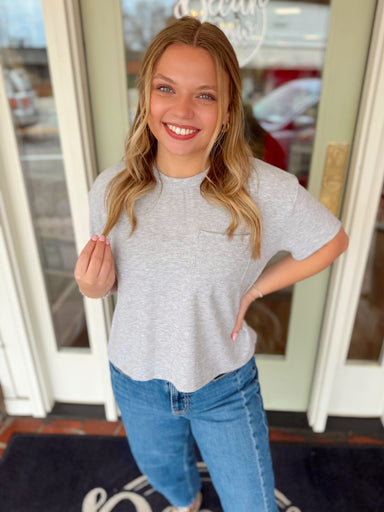 Soft grey short sleeve top with a pocket on the front 