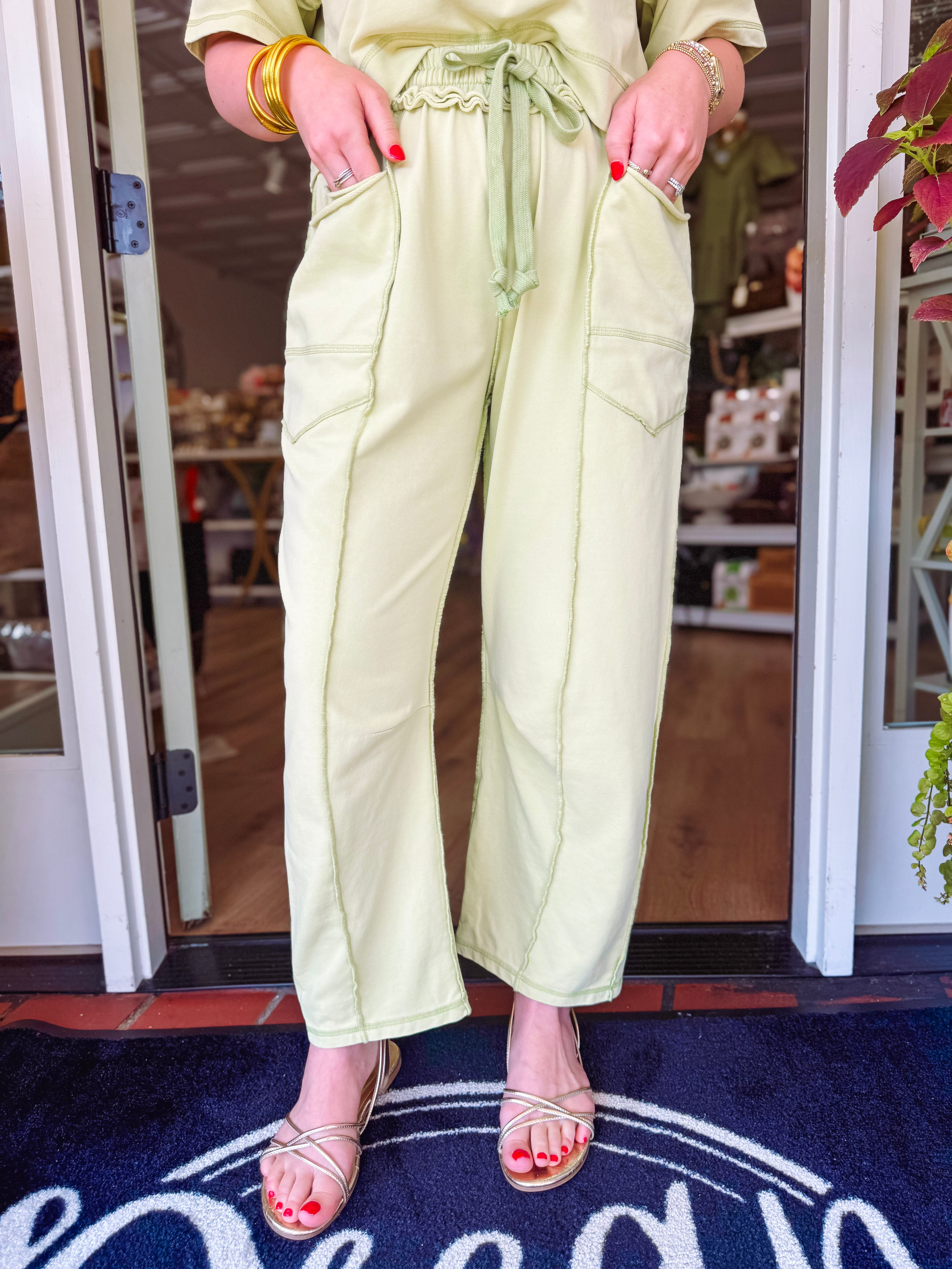 Easy drawstring pants with front pockets and a decorative seam going down the front 