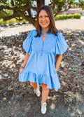 Blue babydoll style dress with lace accents and pockets