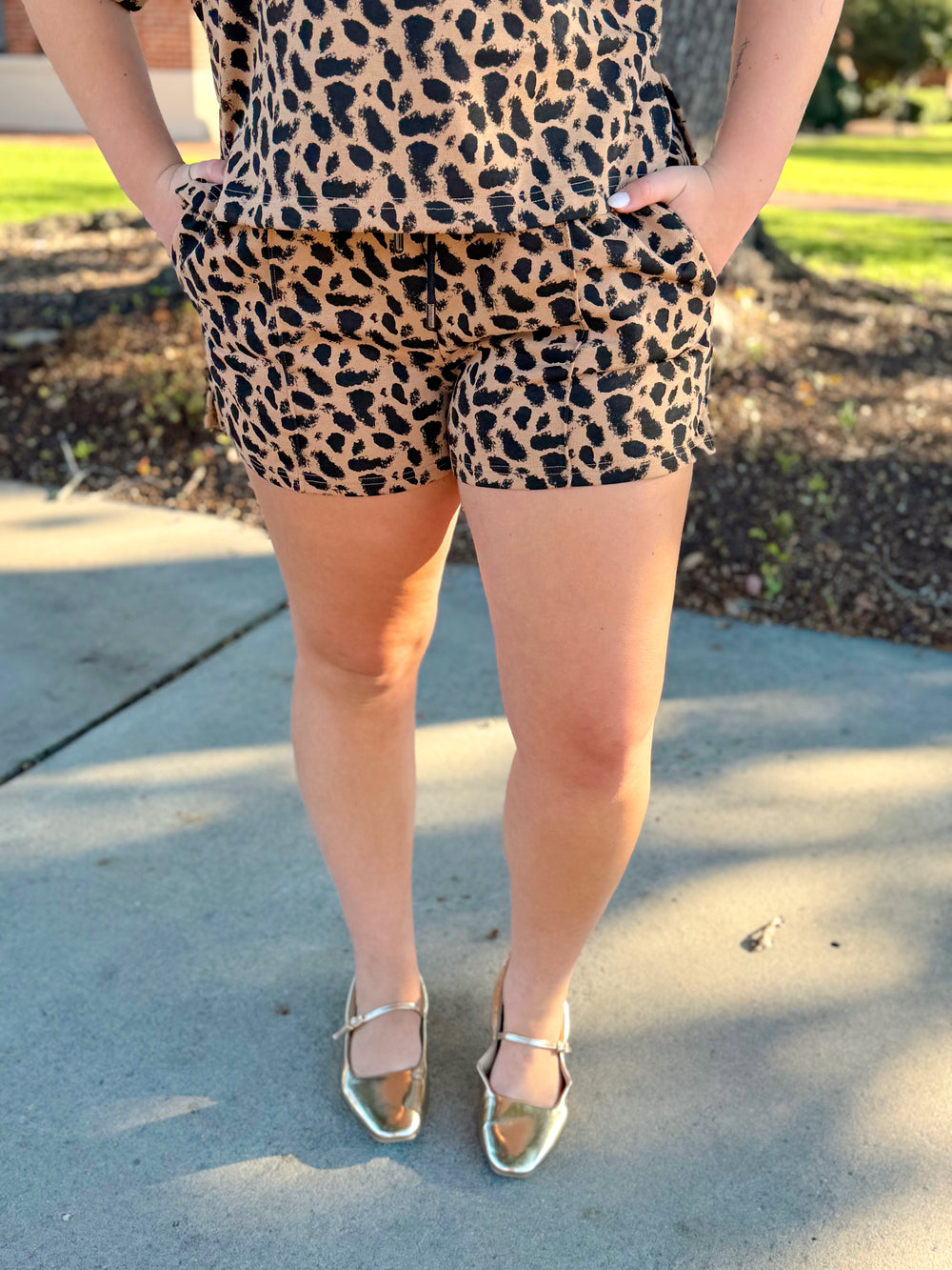  These leopard print shorts feature a classic camel and black color combination with a comfortable drawstring waist and convenient side pockets. 