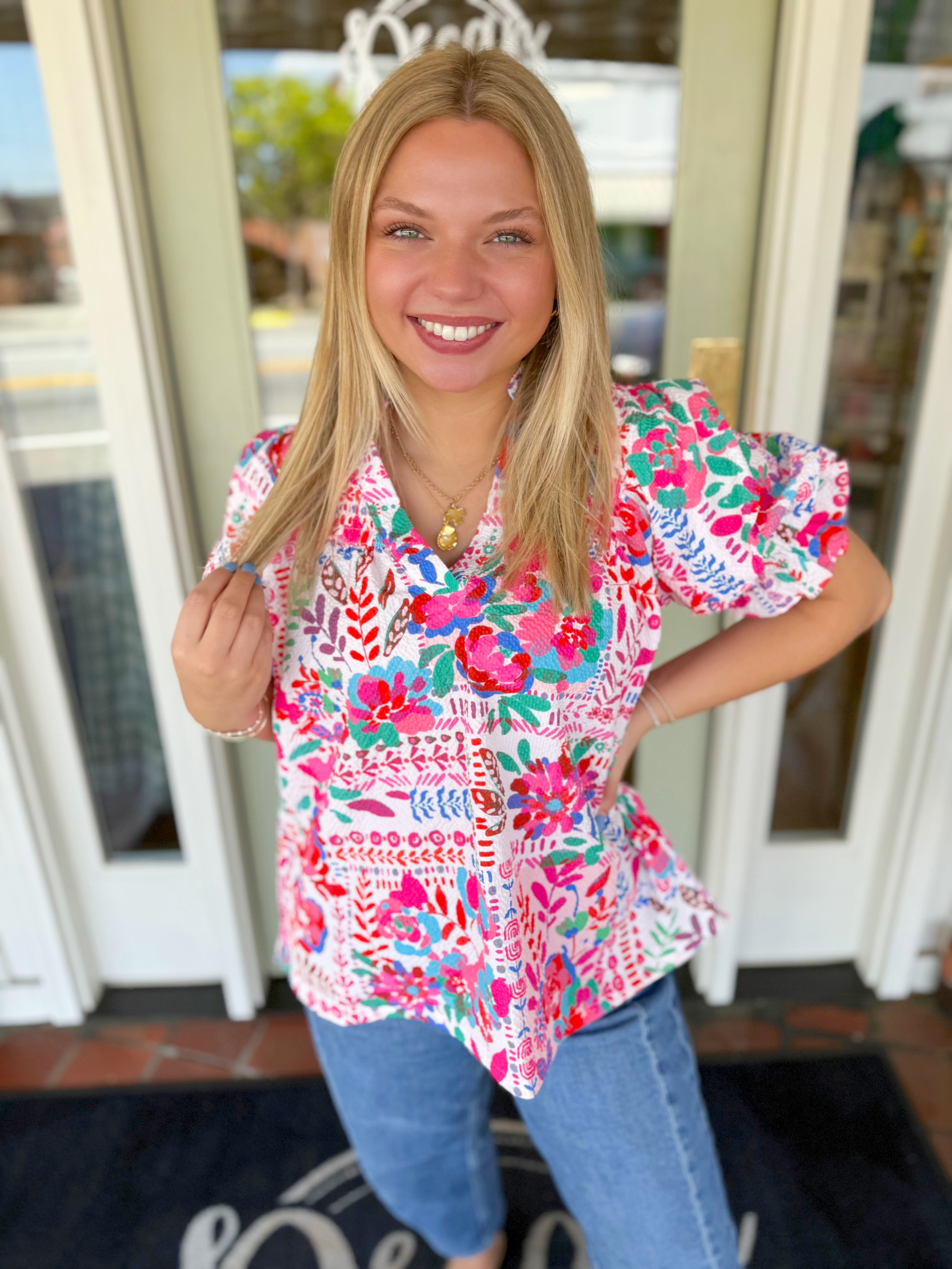 Colorful floral top with subtle puff sleeves