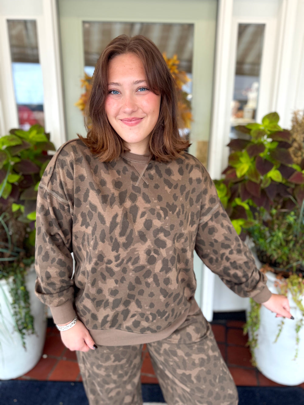 Brown spotted sweater top with shades of dark and light browns 