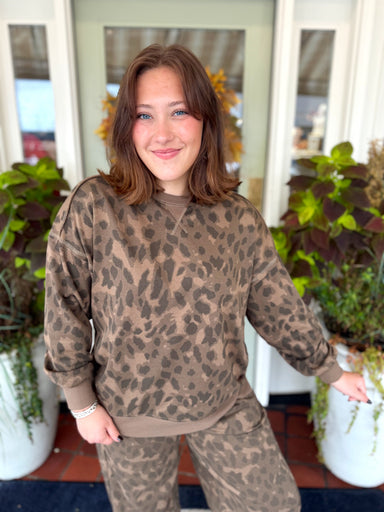 Brown spotted sweater top with shades of dark and light browns 