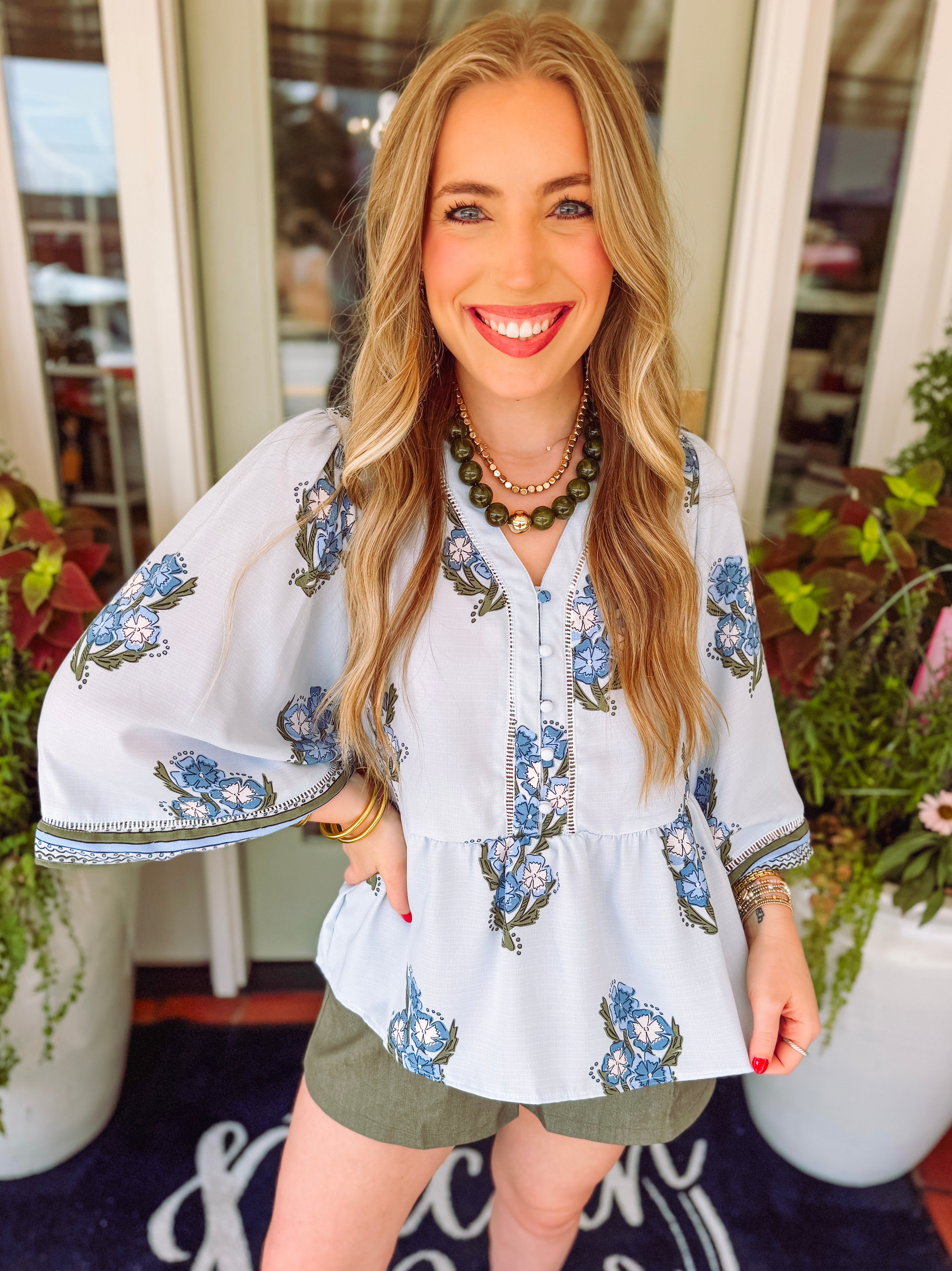 Blue and green floral top with flutter sleeves by mary square