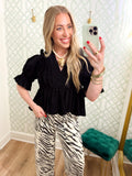  This blouse features a flattering V-neckline framed with delicate ruffle trim, puff sleeves and a gathered peplum hem. 