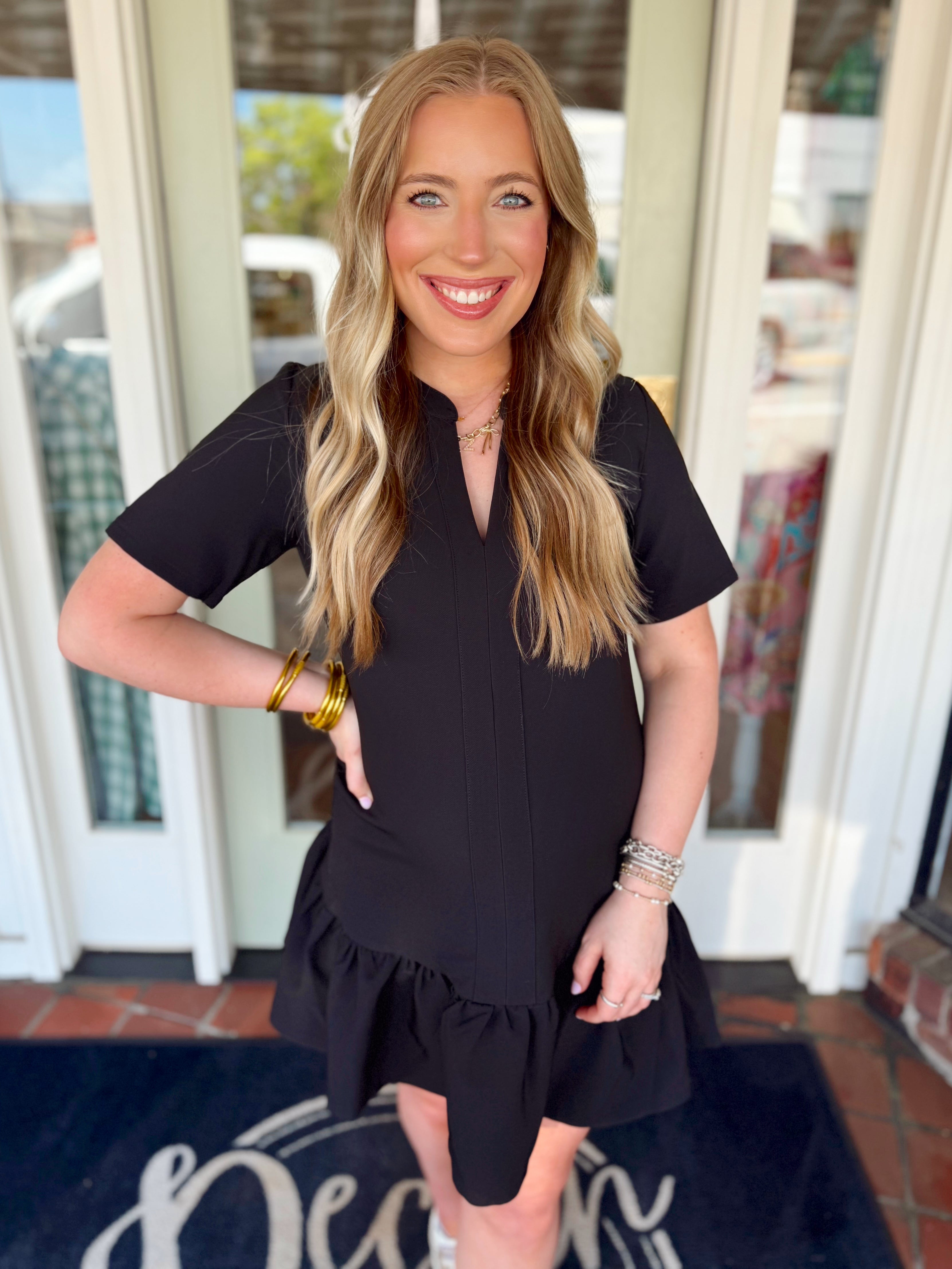 Black dress with ruffle bottom detailing 