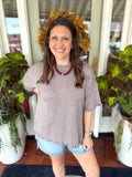 Cocoa Sweater top with ruffle trimming and a slit on the sides 