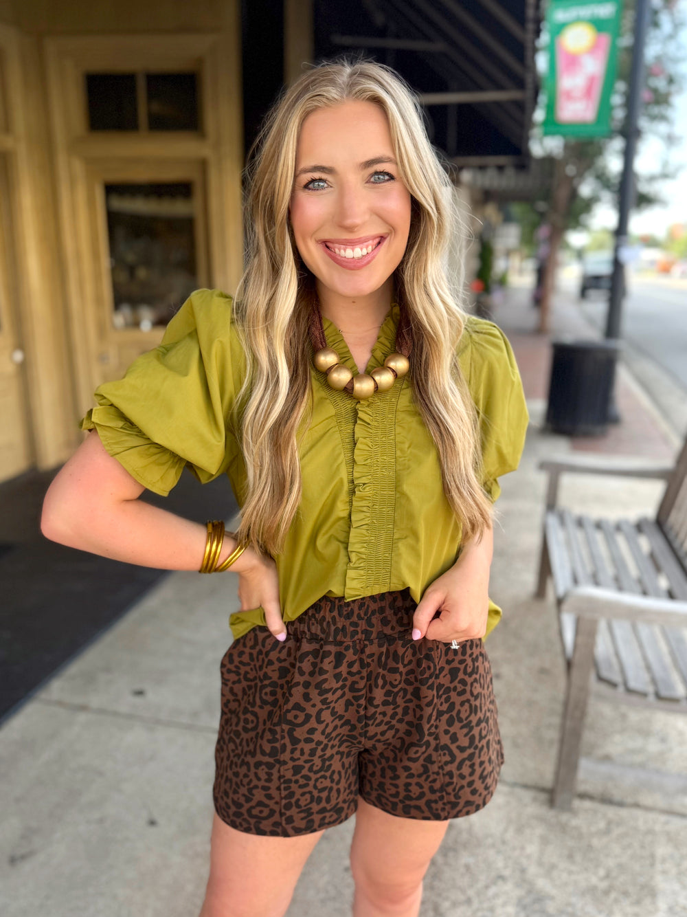 Short sleeve blouse with ruffle sleeves and ruffle neck detailing 