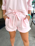 Light pink drawstring shorts with cuff bottom
