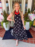 Black and white polkadot sleeveless dress with a ruffle bow detailing neckline