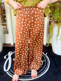  These satin polka dot pants feature a flowy wide-leg silhouette with a sheen that instantly dresses up any look. 