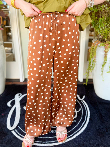  These satin polka dot pants feature a flowy wide-leg silhouette with a sheen that instantly dresses up any look. 