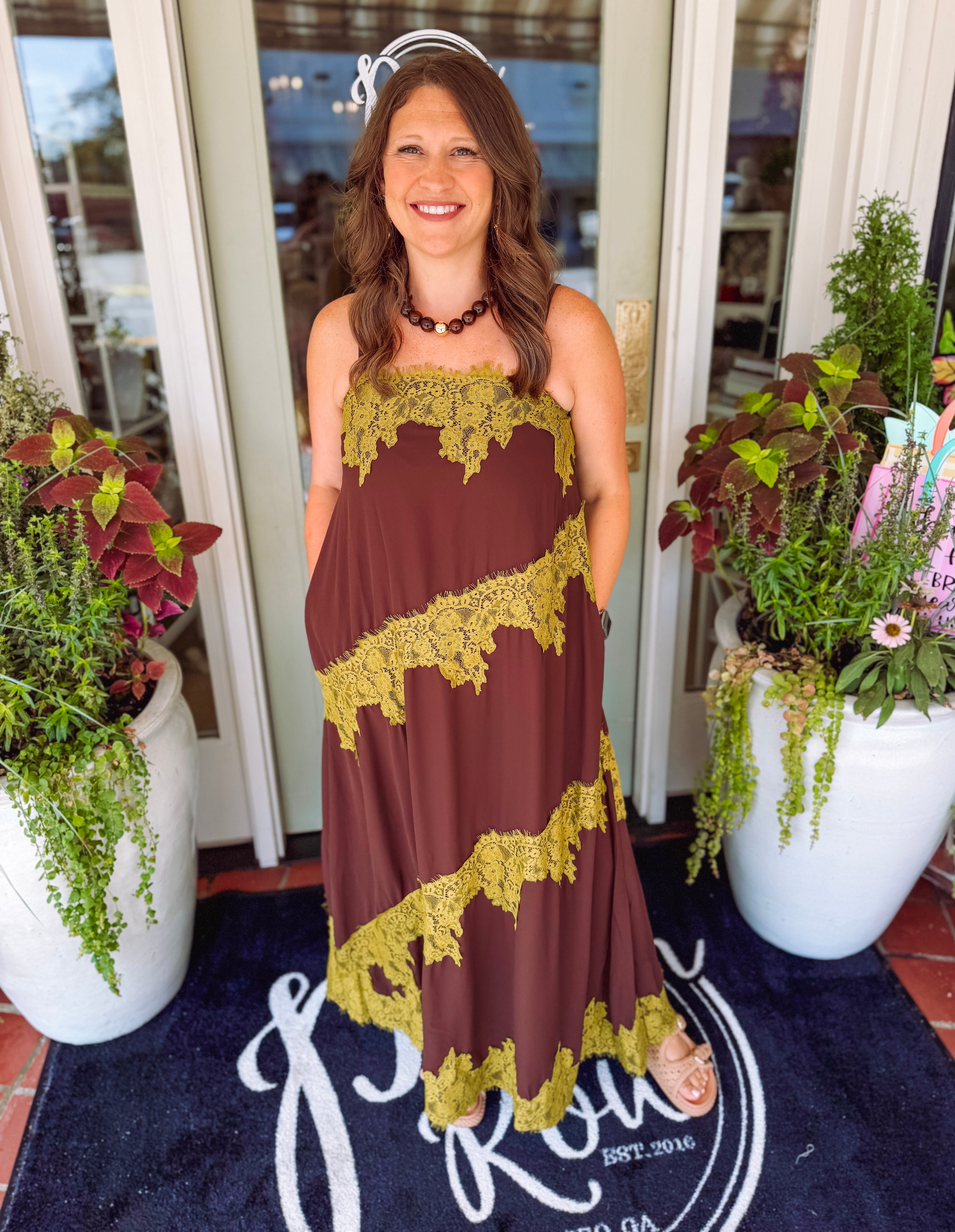 Brown dress with contrast chartreuse lace detailing. 