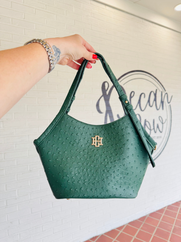green textured saddle bag with straps