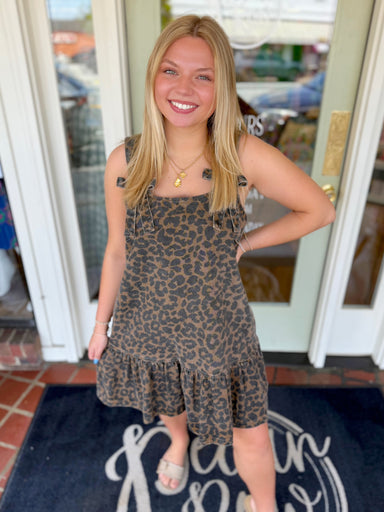 Leopard print dress with ruffle bottom and bow detailing on strap