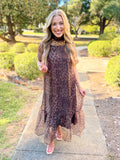 The maxi dress features an allover brown leopard print in a lightweight, sheer overlay with an easy, flowy silhouette.