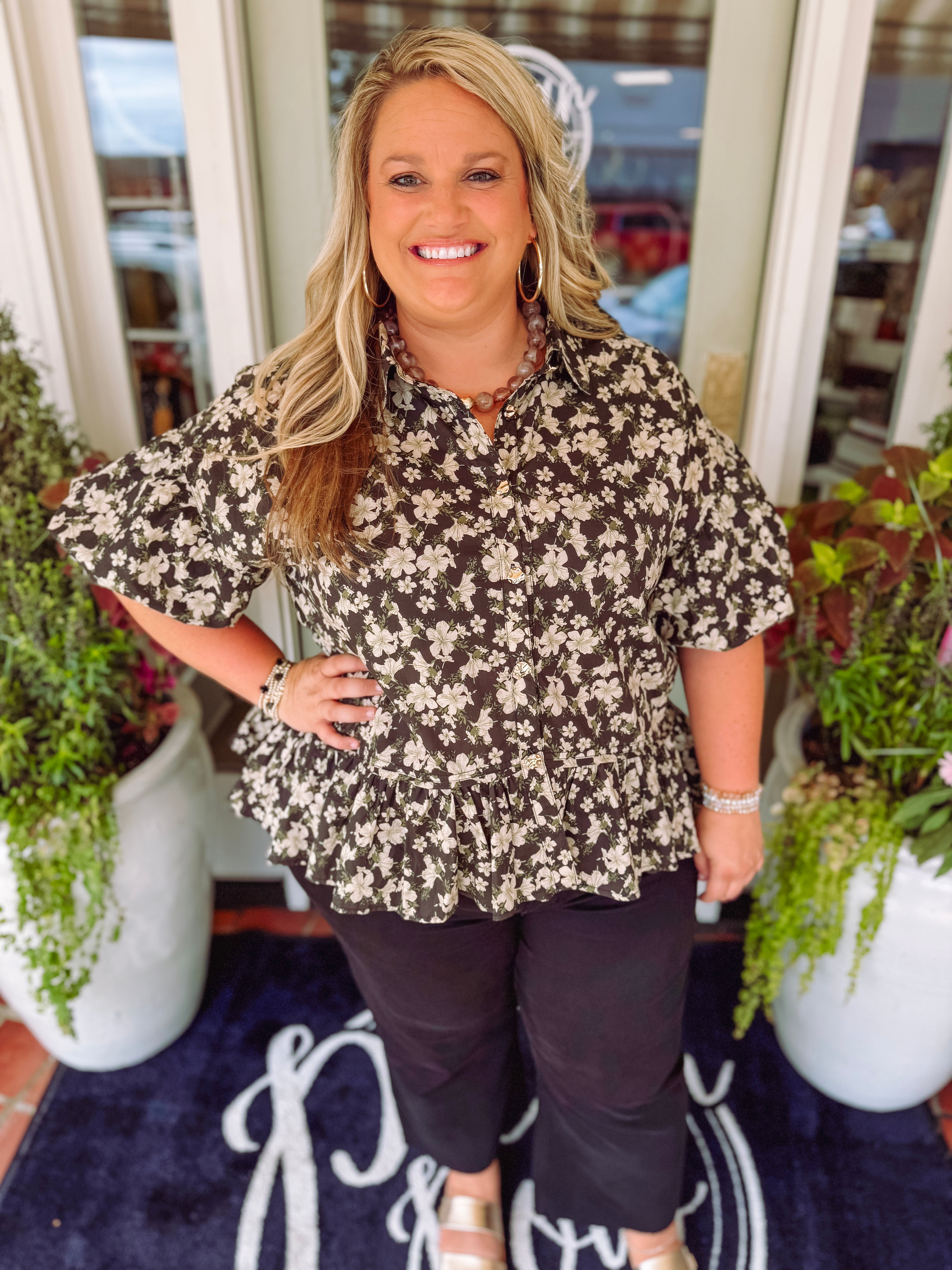 Floral printed ruffle hem top with gold buttons down the front