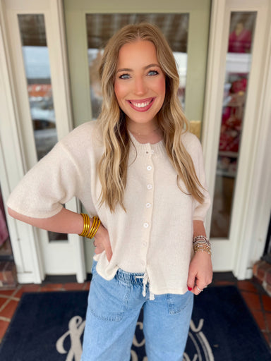 Knit cardigan in ivory with functional buttons down the front 