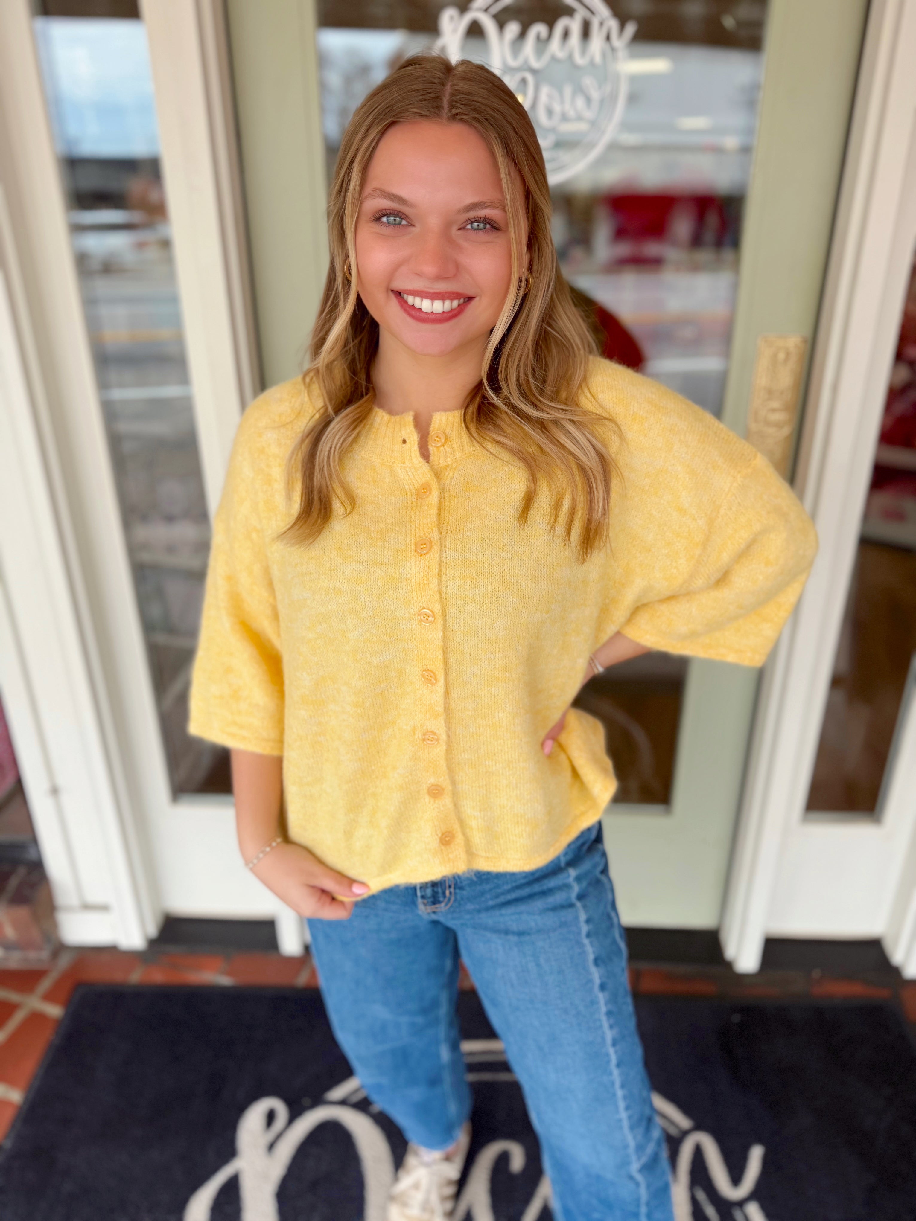 Yellow soft knit cropped cardigan with functional buttons down the front