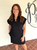 Black short-sleeve dress with a scalloped hem