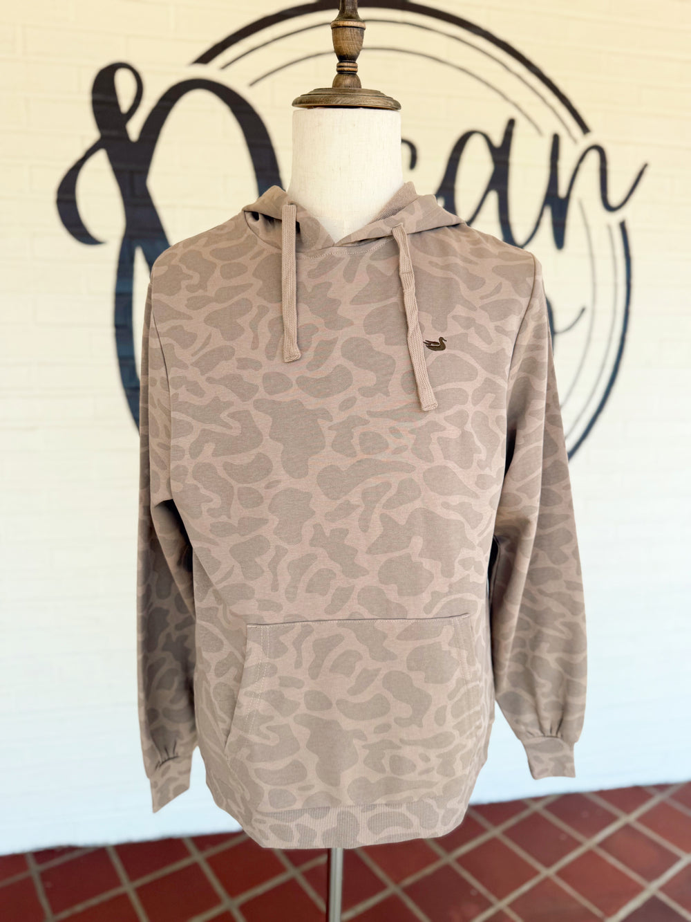  This lightweight camo hoodie features a soft tonal camouflage print in brown hues, an adjustable drawstring hood, and a roomy front kangaroo pocket. 
