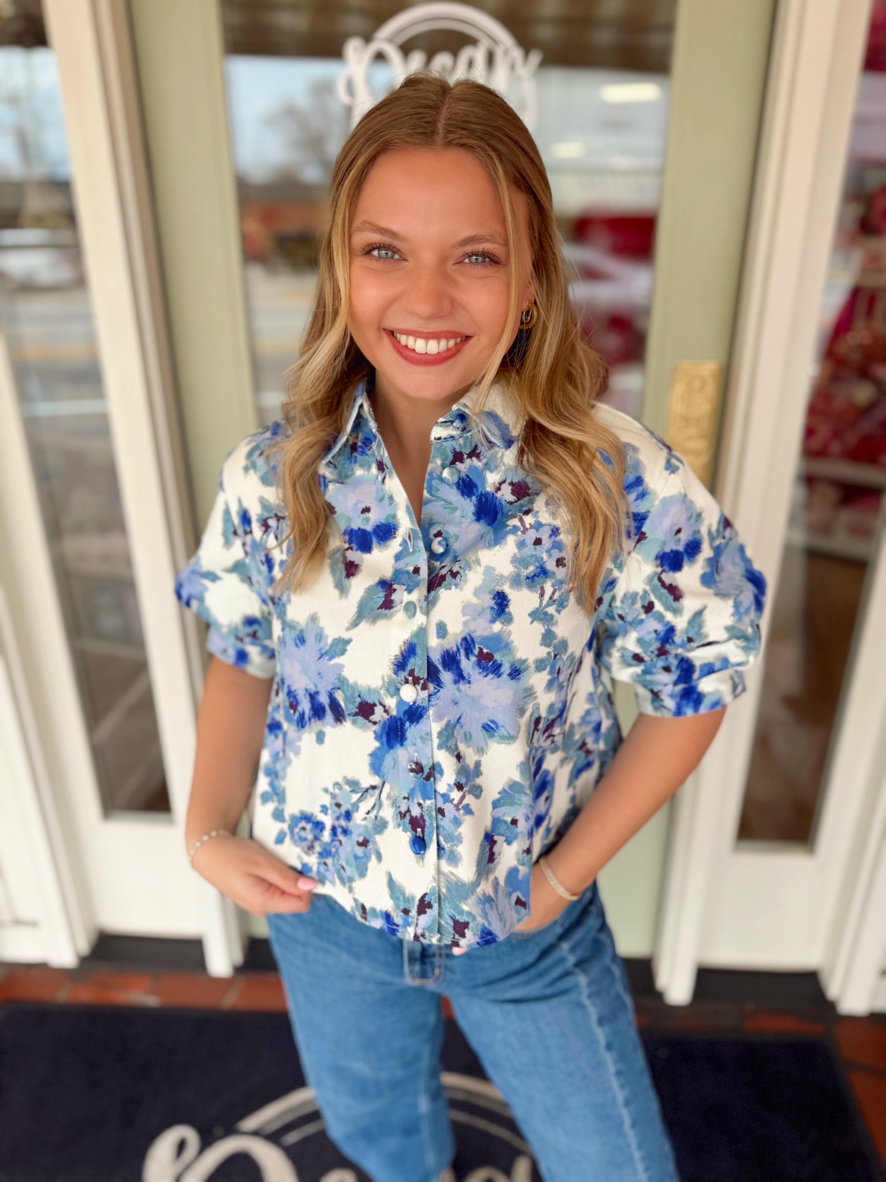Blue and white floral cropped shirt with buttons down the front 