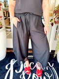 Black lace trim cropped pants with an elastic waistband and pockets