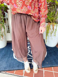 A fun pair of cropped balloon pants featuring a relaxed, easy silhouette with delicate lace trim detailing for a feminine touch.