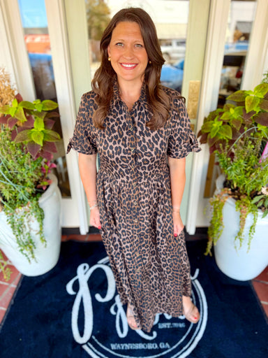 This leopard midi dress features a button-down front, relaxed flowy fit and side pockets.