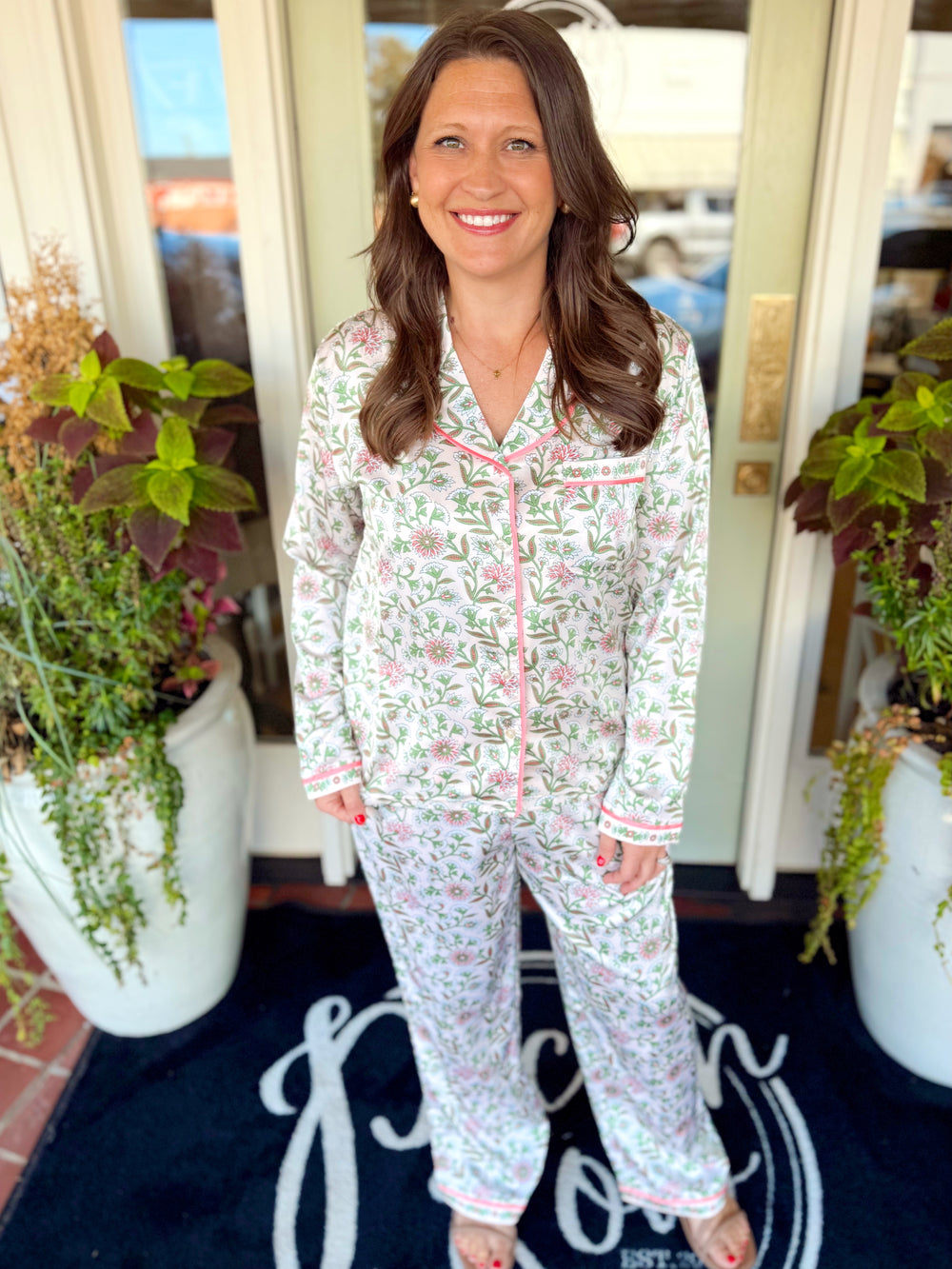 A button down satin pajama set with green and pink florals 